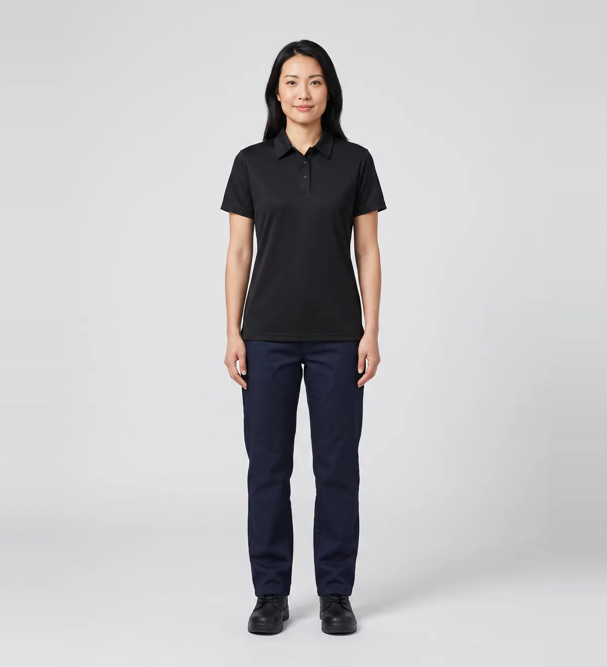 Black polo from the NextGen catalogue on model